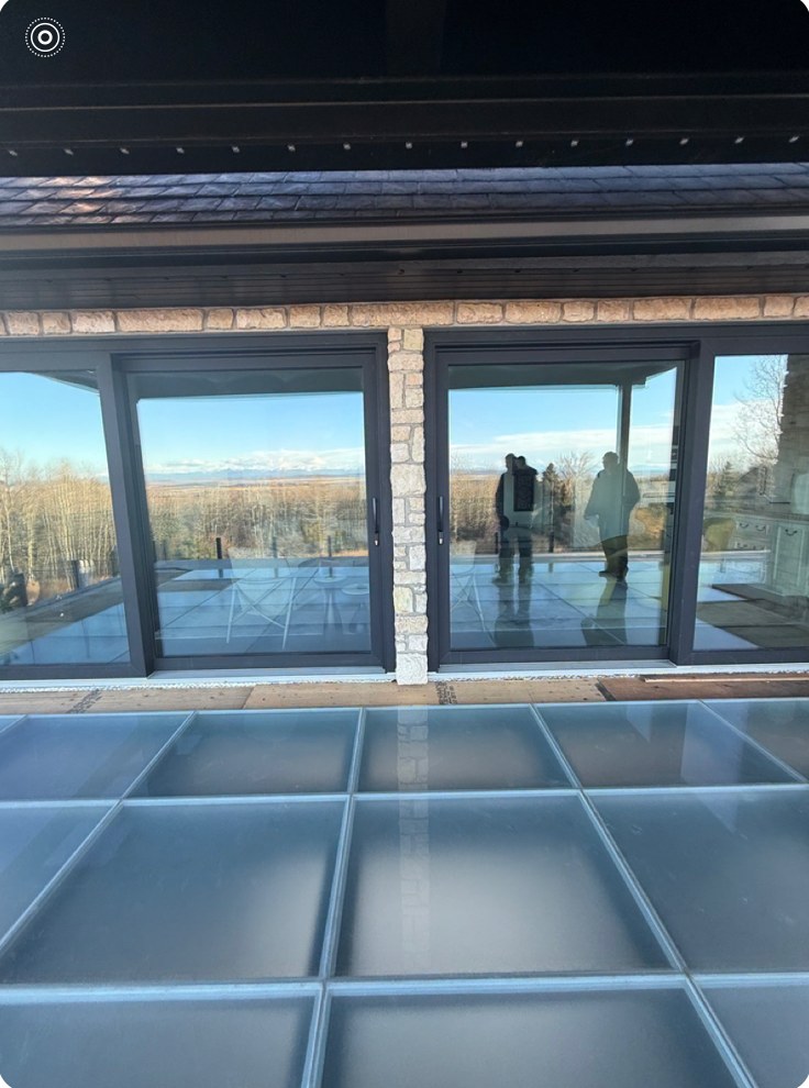Glass floor panels and mountain view